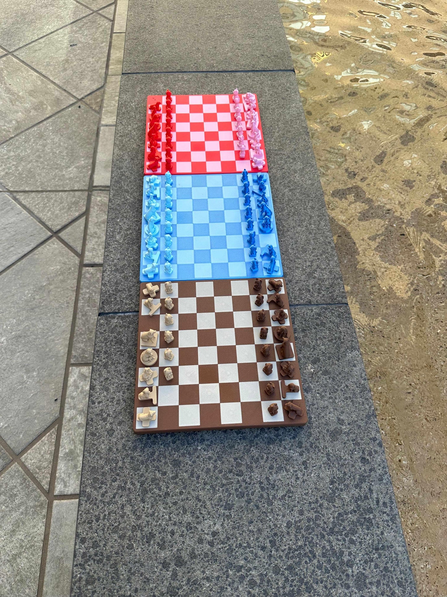 Dog Chess travel set with magnetic dachshund chess pieces in red, blue, and brown boards