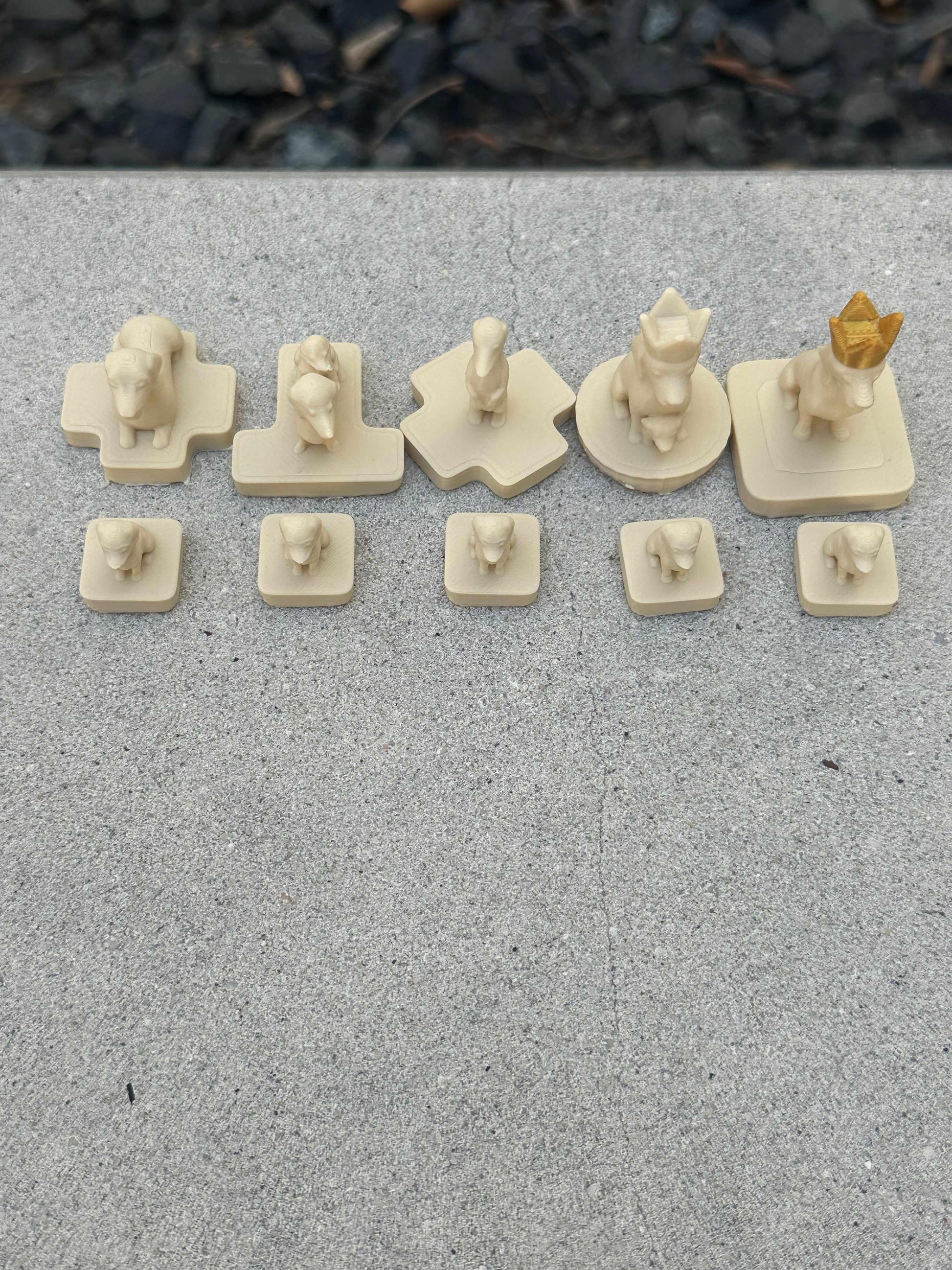 Wienerdog Chess full cream-colored dachshund chess piece set including pawns, knight, rook, bishop, queen, and crowned king