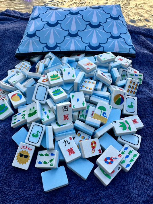Collection of blue and white tiles with various symbols on a blue surface