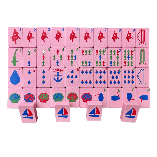 Set of pink mahjong travel tiles with a nautical theme.