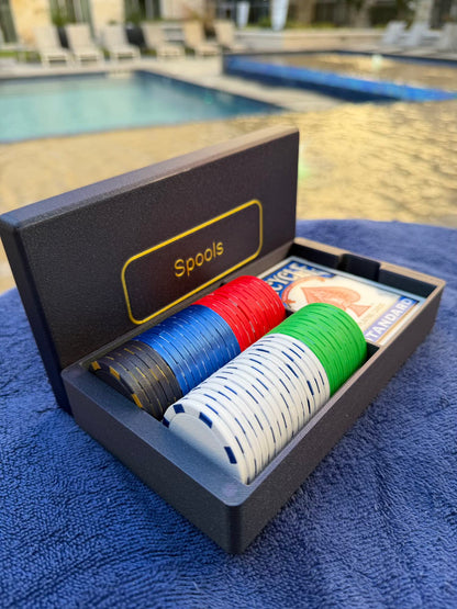 Close-up of Spools lightweight poker chips in multiple colors showing textured surface and edge detail.
