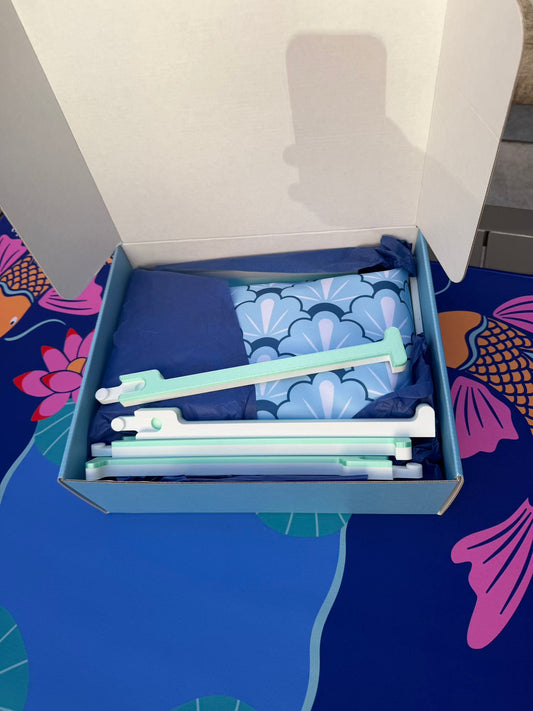 Spools Pickleball mahjong set stored inside a compact travel case showing green racks and accessories.