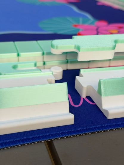Spools Pickleball mahjong game components laid out on a pickleball-themed mat, highlighting portable setup.