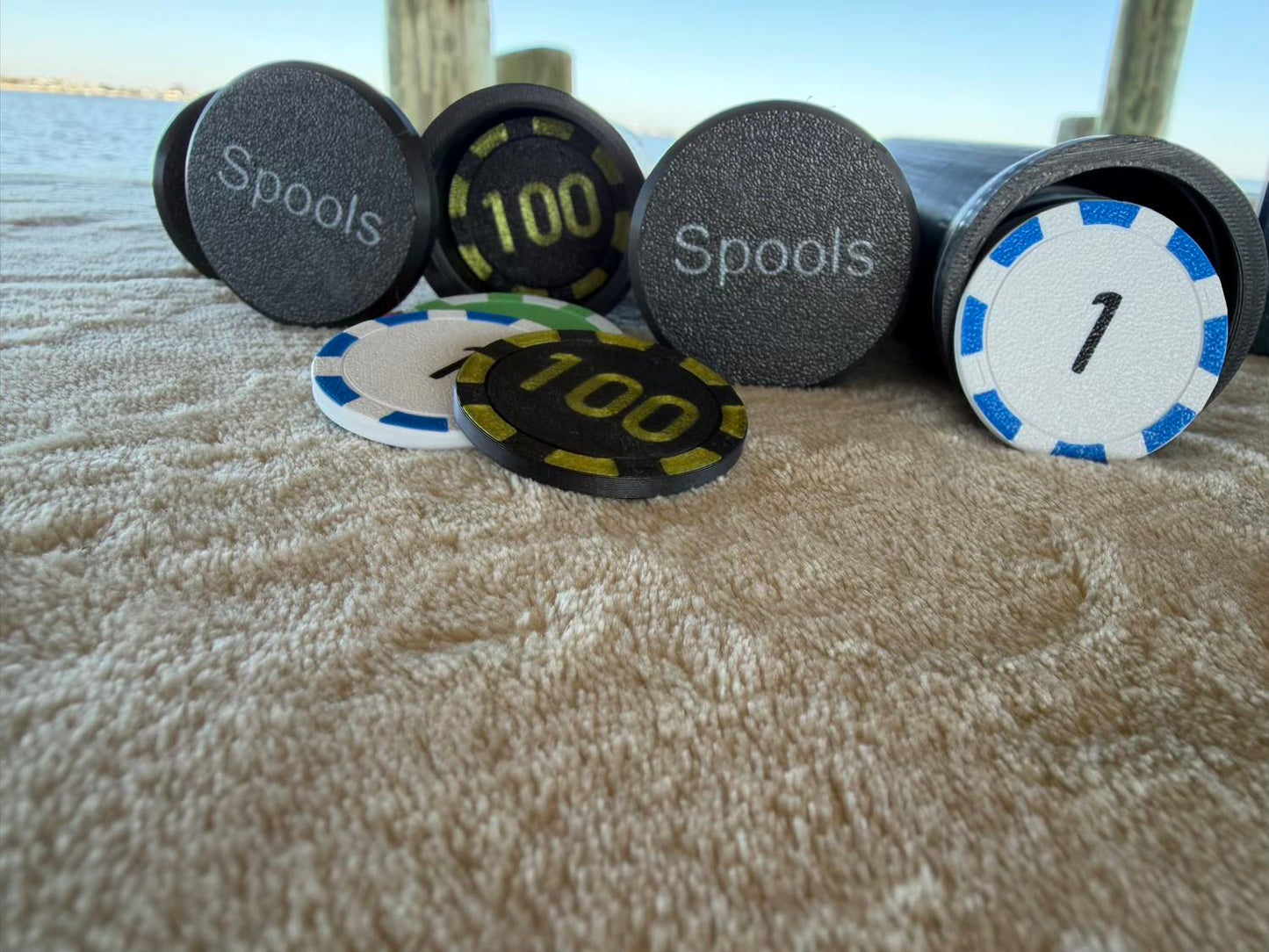 Close-up of Spools lightweight poker chips showing chip faces, colors, and printed values