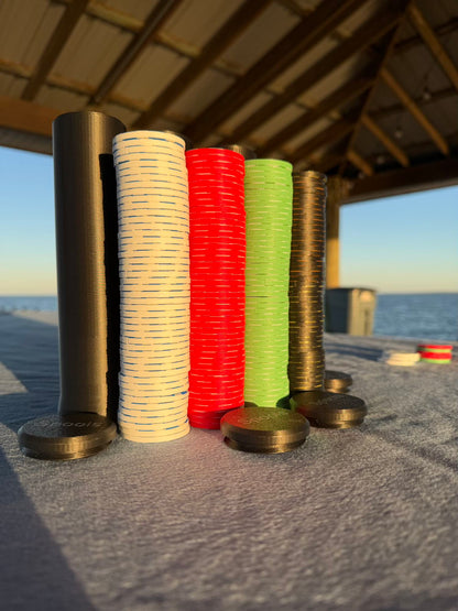 Spools lightweight poker chips stacked in tall columns showing multiple colors and slim chip profile.