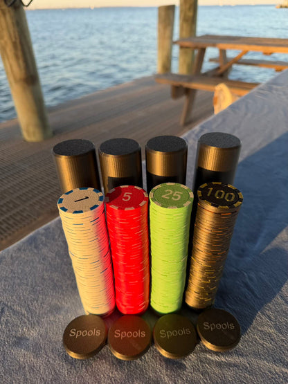 Spools travel poker set showing stacked lightweight poker chips next to compact black carrying cases.