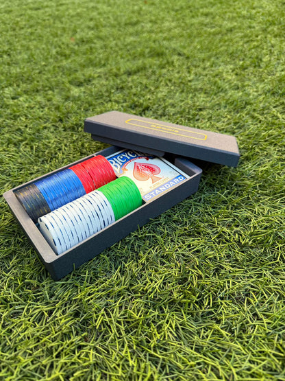 Spools travel poker set opened to show organized rows of lightweight poker chips and playing cards inside the case.
