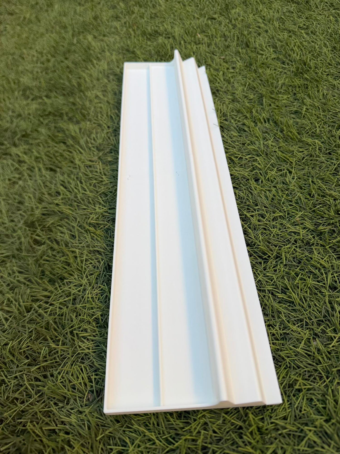 Solid White Travel American Mahjong Travel Racks on a grass surface