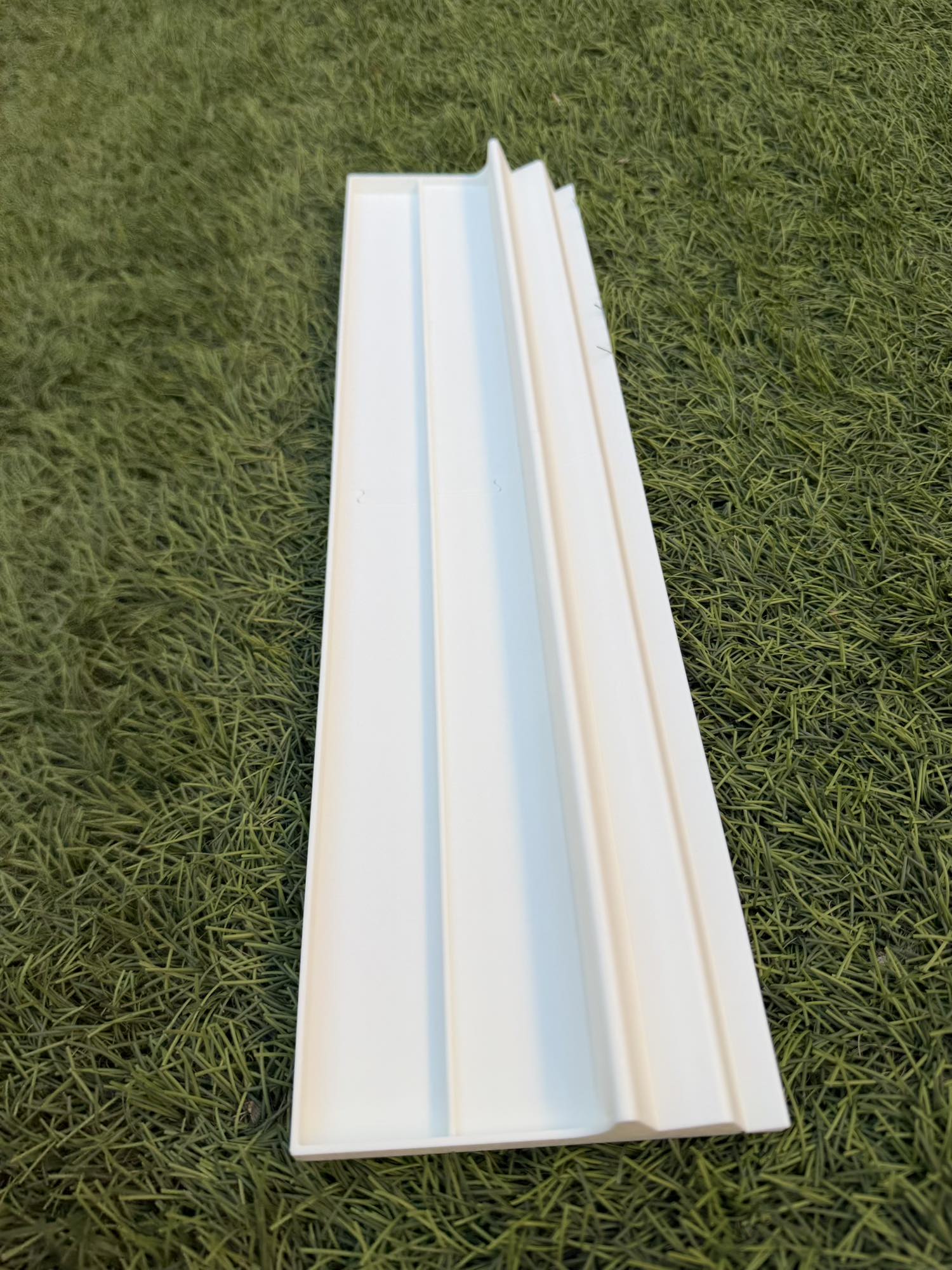 Solid White Travel American Mahjong Travel Racks on a grass surface