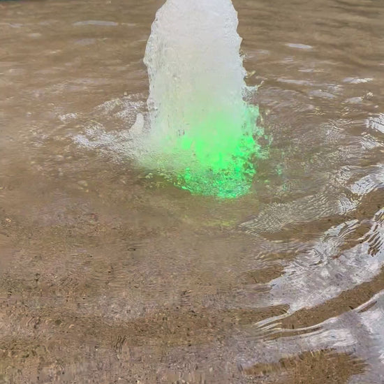 A video of american mahjong tiles floating and being waterproof for poolside play through a fountain