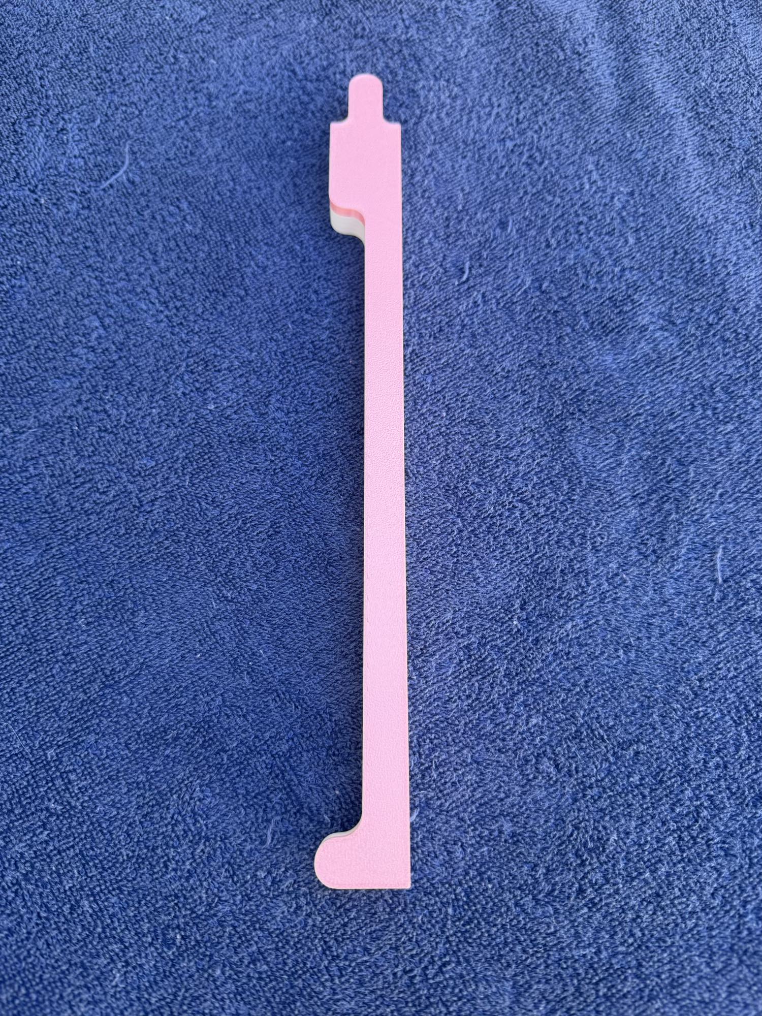 Front view of the pink Travel Mahjong pusher showing the lightweight, travel-friendly design.
